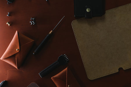 Crafting tools on natural cow leather in the tailoring workshop. Top view.の写真素材
