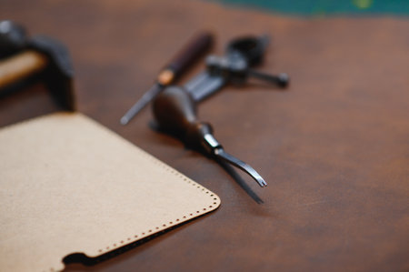 Crafting tools on natural cow leather in the tailoring workshop. Top view.の写真素材