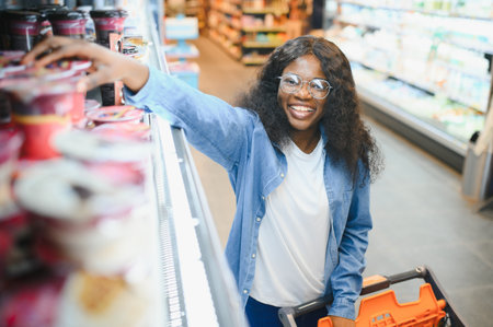 Cheerful African American Woman In Supermarket.の写真素材