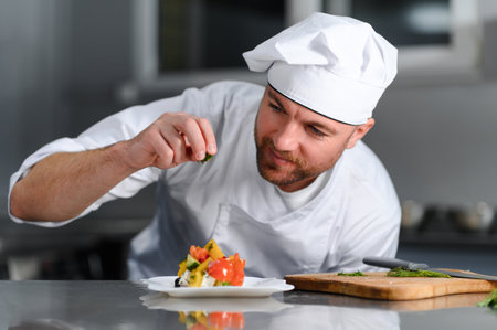 Professional Chef Working in a Famous Restaurant Kitchen.の写真素材