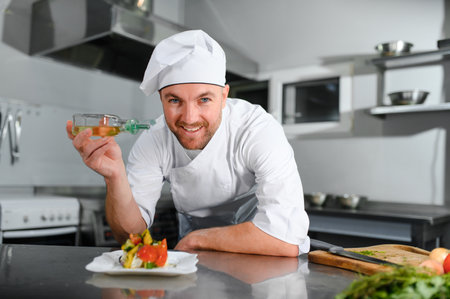 Professional Chef Working in a Famous Restaurant Kitchen.の写真素材