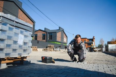Paver laying driveway pavement out of concrete pavement blocks.の写真素材