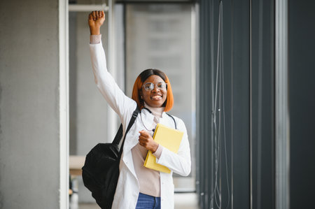 Female African-American student in hall of medical university.の写真素材