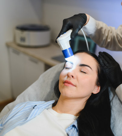 Doctor diagnoses the structure of the hair. Consultation with a trichologist.