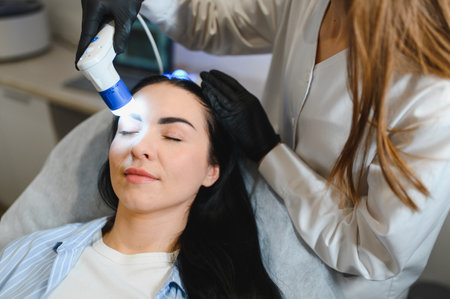 Hair doctor checking hair. Diagnostics hair and scalp. Trihoskopiya. Doctor examine patient female...