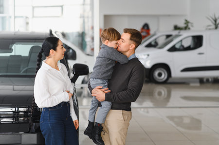 young caucasian family choosing a car in dealership, they want the most comfortable and safe carの写真素材
