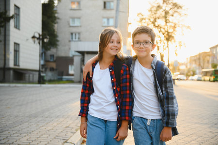 Portrait of smiling school kids standing at school yard.の写真素材