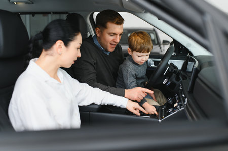 Happy family buying a new car at the car showroom.