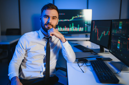 Crypto trader investor analyst looking at computer screen analyzing financial graph data on pc...