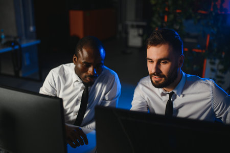 Team of traders working with forex trading charts and graphs on computer screen.の写真素材