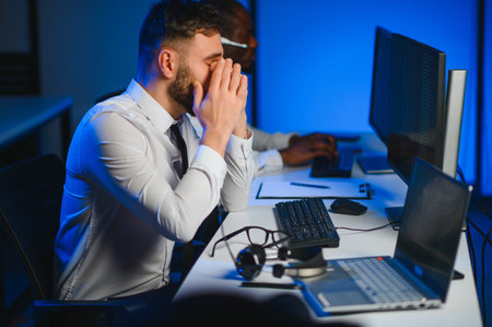 Unhappy angry call center worker frustrated with workload.の写真素材