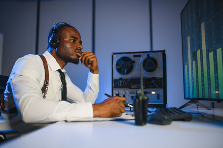 A police officer records a telephone conversation on a tape recorder. secret agentの写真素材