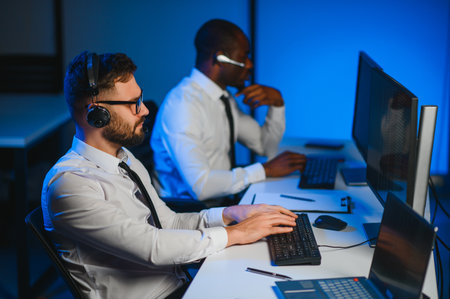 Young male technical support dispatcher in call center.の写真素材