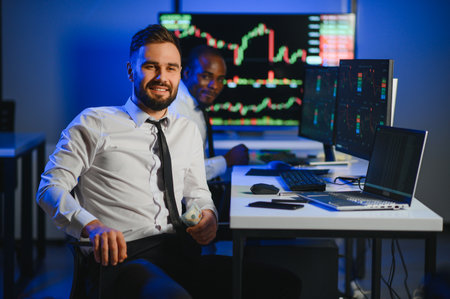Crypto trader investor analyst looking at computer screen analyzing financial graph data on pc...