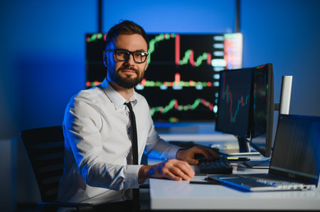 Crypto trader investor analyst looking at computer screen analyzing financial graph data on pc monitor, thinking of online stock exchange market trading investment global risks, over shoulder view.の写真素材