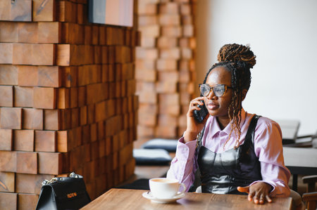 african american woman using phone.の写真素材