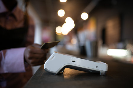 female customer holding credit card near nfc technology on counter, client make transaction pay bill...