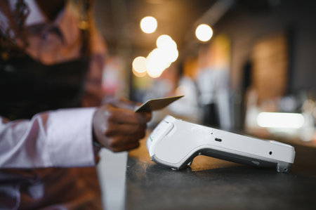 female customer holding credit card near nfc technology on counter, client make transaction pay bill...