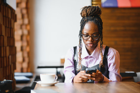 african american woman using phone.の写真素材