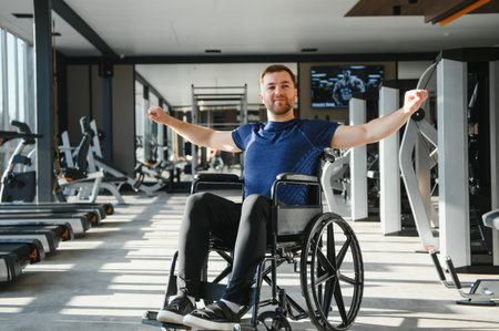 Man with disability exercising in a wheelchair at the gym, demonstrating perseverance and strength...