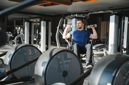 Person with disability exercising with dumbbells, demonstrating resilience and strength during...