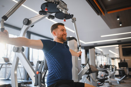 Person with disability exercising back muscles using accessible gym equipment, promoting inclusive...