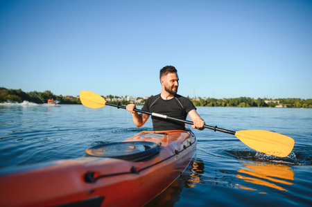 Man kayaking on a serene lake, savoring the peacefulness of nature while enjoying a summer vacation...
