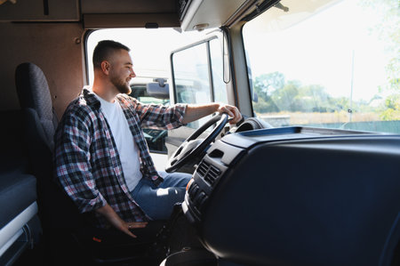 Professional truck driver smiling, sitting in heavy goods vehicle cab, looking forward to long haul...