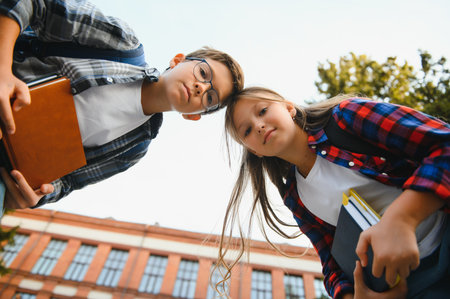 Portrait of smiling school kids standing at school yard.の写真素材