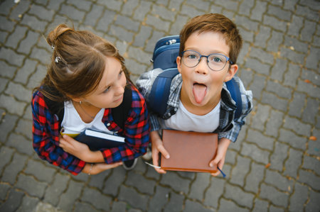 Portrait of smiling school kids standing at school yard.の写真素材