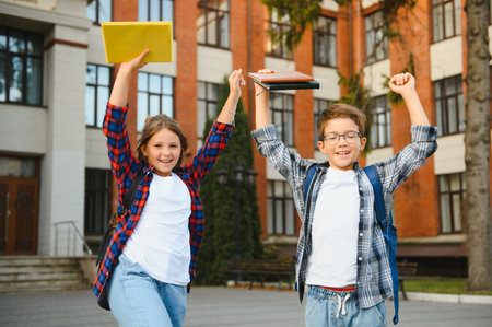 Portrait of smiling school kids standing at school yard.の写真素材