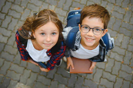 Portrait of smiling school kids standing at school yard.の写真素材