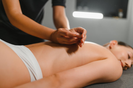 Beautiful woman having relaxing in spa massage salon.の写真素材