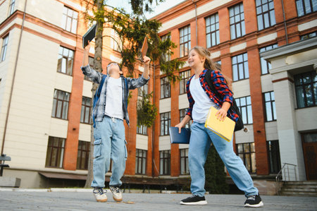 Portrait of smiling school kids standing at school yard.の写真素材