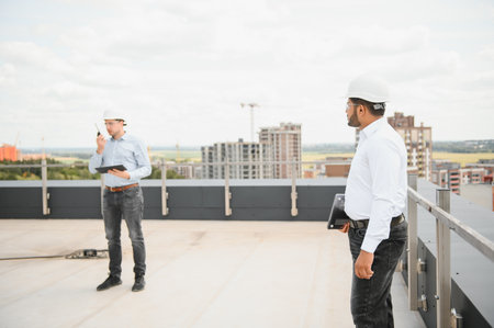 Construction workers together at a construction site.の写真素材