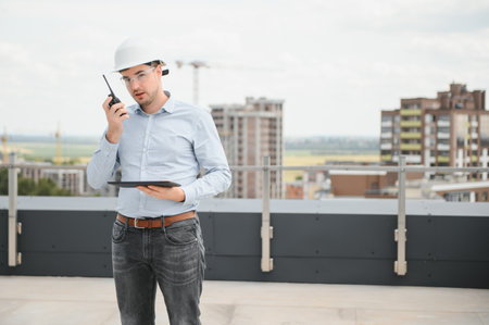 construction concept. Portrait of a young architect at a construction site.の写真素材