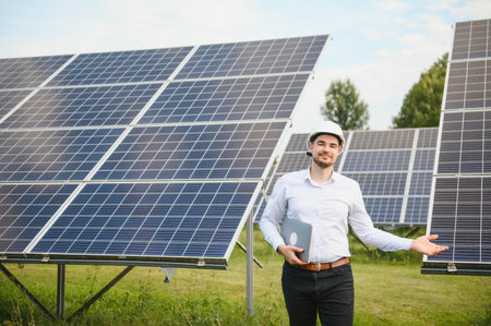 Solar power plant. Engineer on a background of photovoltaic panels. Science solar energy