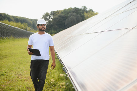 Indian Engineer near solar panel.の写真素材