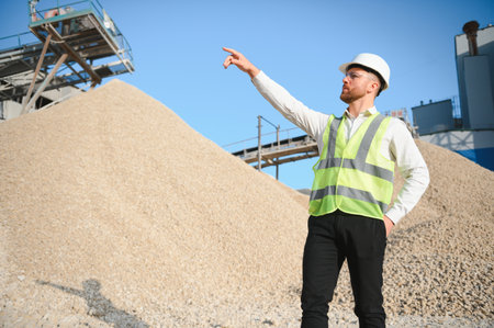 An engineer at a crushed stone or gravel plant. Stone mining.の写真素材
