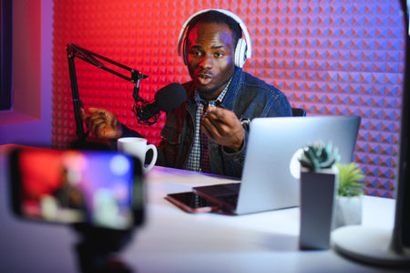 Black male influencer creates material for his internet audience, discussing new trends.