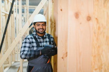 Construction of modular houses. Construction worker or engineer at construction site.