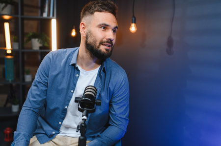 Content creator recording an audio podcast in a modern home studio, utilizing a professional...