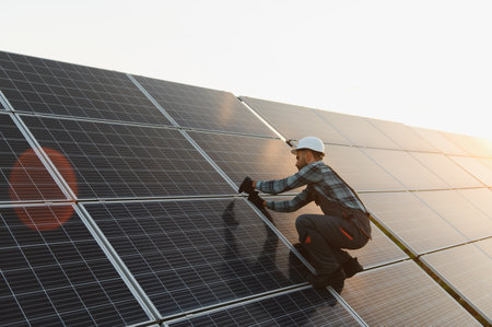 Technician installing solar panels, ensuring efficient function of renewable energy system....