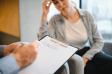 Patient discussing mental health problems and psychological issues with a therapist, seeking...