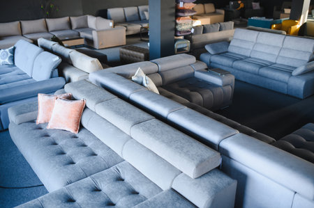 Furniture store showroom presenting various contemporary seating arrangements, promoting home decor and interior design for living spacesの写真素材