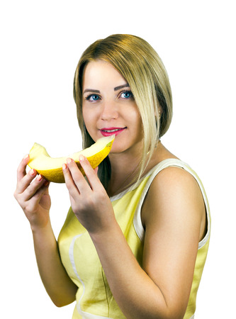 young girl with fruit in their hands isolatedの写真素材