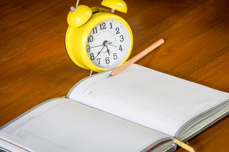 retro alarrm clock and notebook.の写真素材