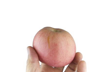 pink apple on human hand holkdingの写真素材