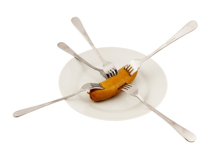 Dish, sausage and five stainless steel forks  isolated on the white background の写真素材