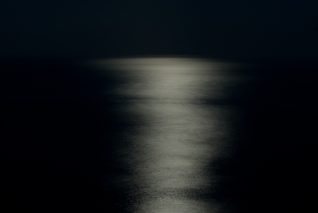 Moon's path to the sea の写真素材